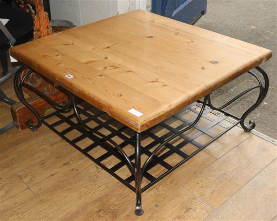A pine topped coffee table with wrought iron base, W.91cm